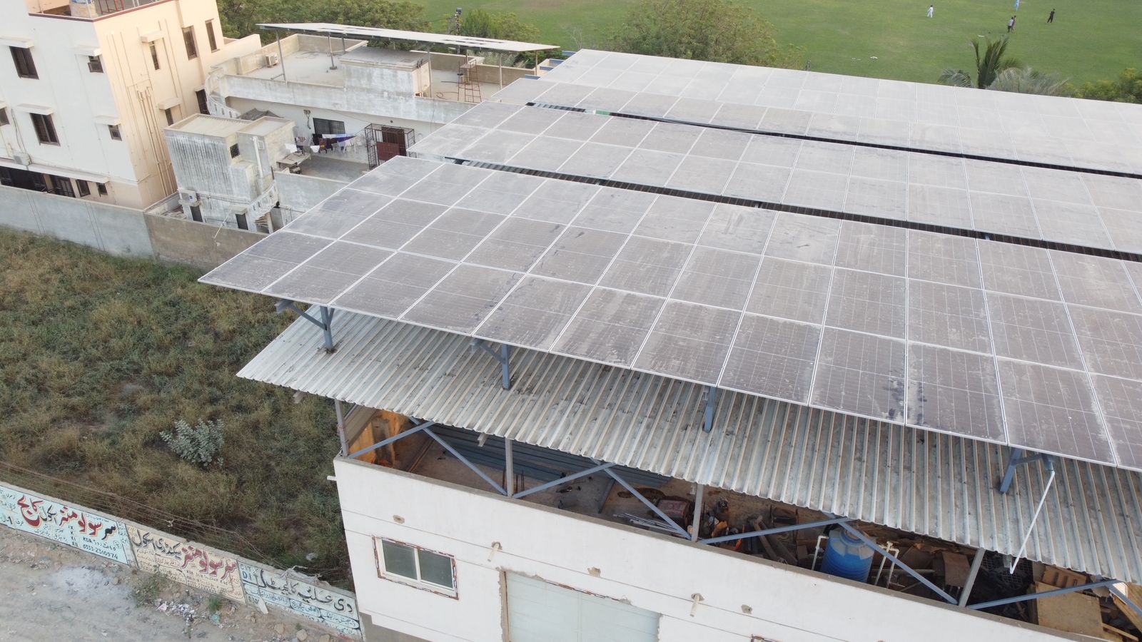 Aerial view of large rooftop solar panel array